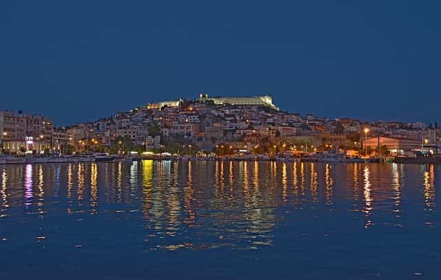 A panoramic view of Kavala at night from the sea