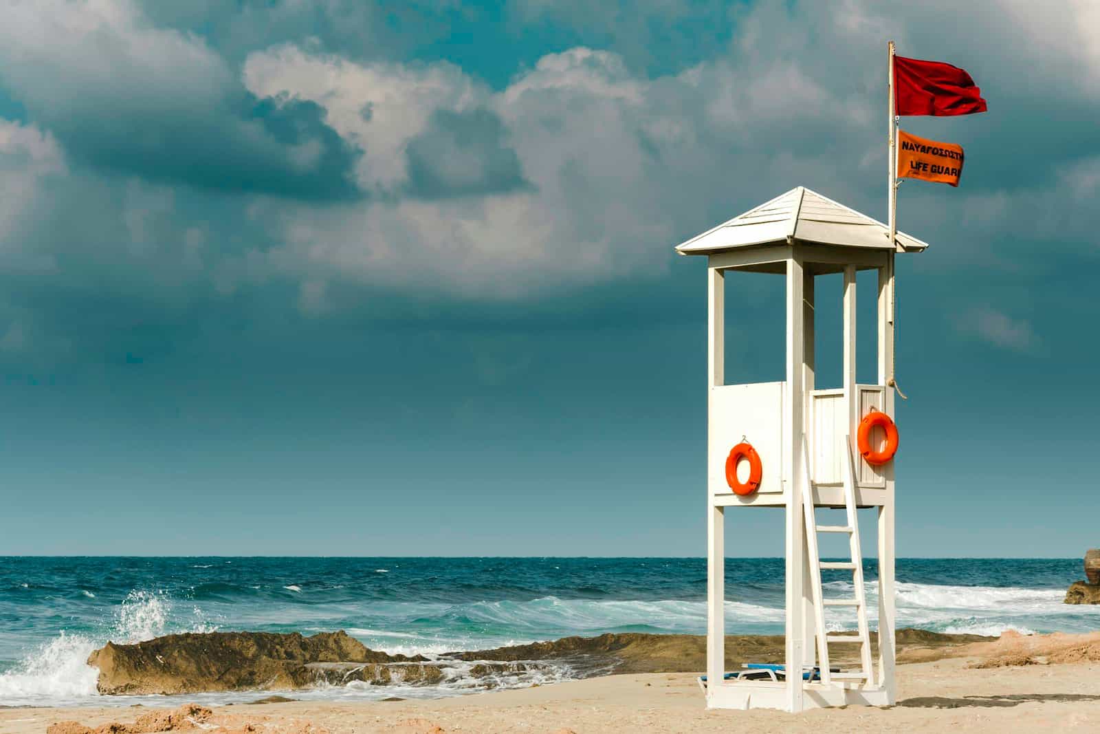 A white wooden lifeguard hut on the seashore at Malia, Crete, Greece