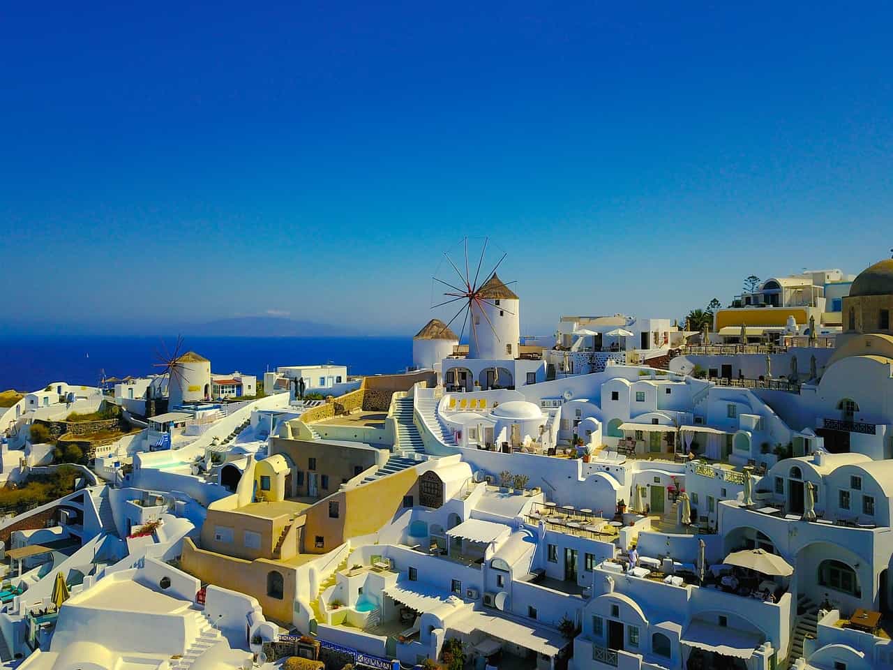 Santorini's white-washed houses under the blues sky