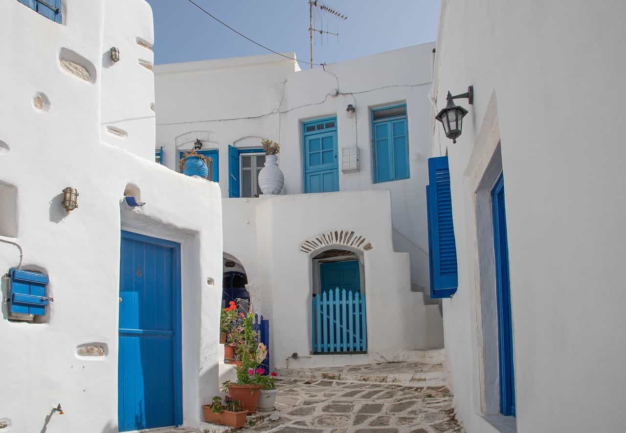 Whati-washed houses with blue door in Paros