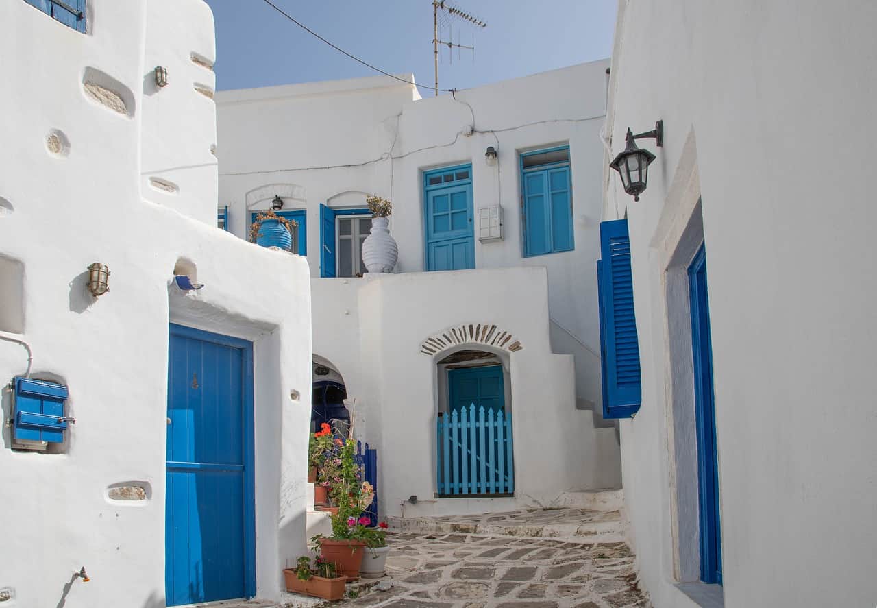 Whati-washed houses with blue door in Paros