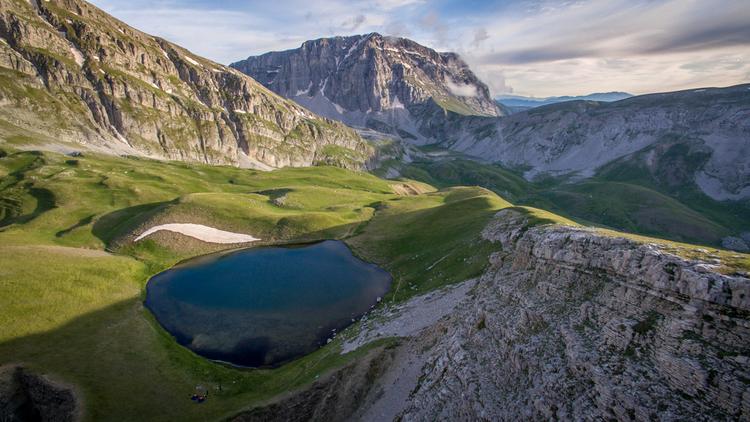 An alpine lake (dragon lake) surrounded by the mountains of Epirus in Greece